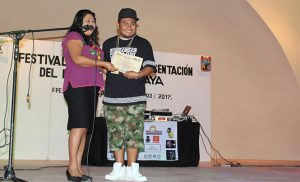 Recognizing Pat Boy (rapper and founder of ADN Maya) for his work with ADN Maya
